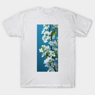 Soft white flowers against aquamarine sky sets a peaceful and romantic mood T-Shirt